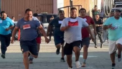 Participantes de una carrera recreativa recorren un circuito durante una competencia al aire libre